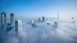 image of large buildings above clouds in Dubai
