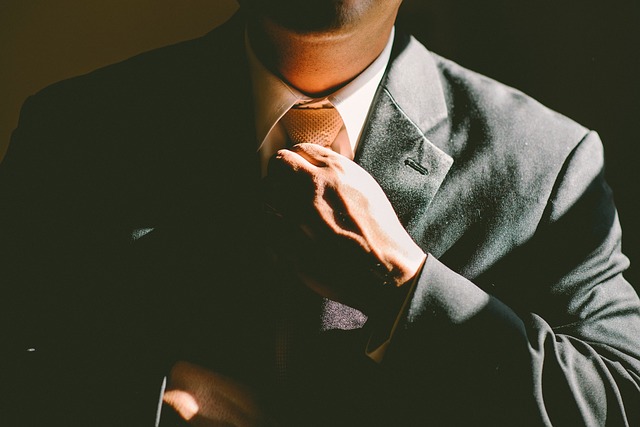 image of a professional adjusting his tie